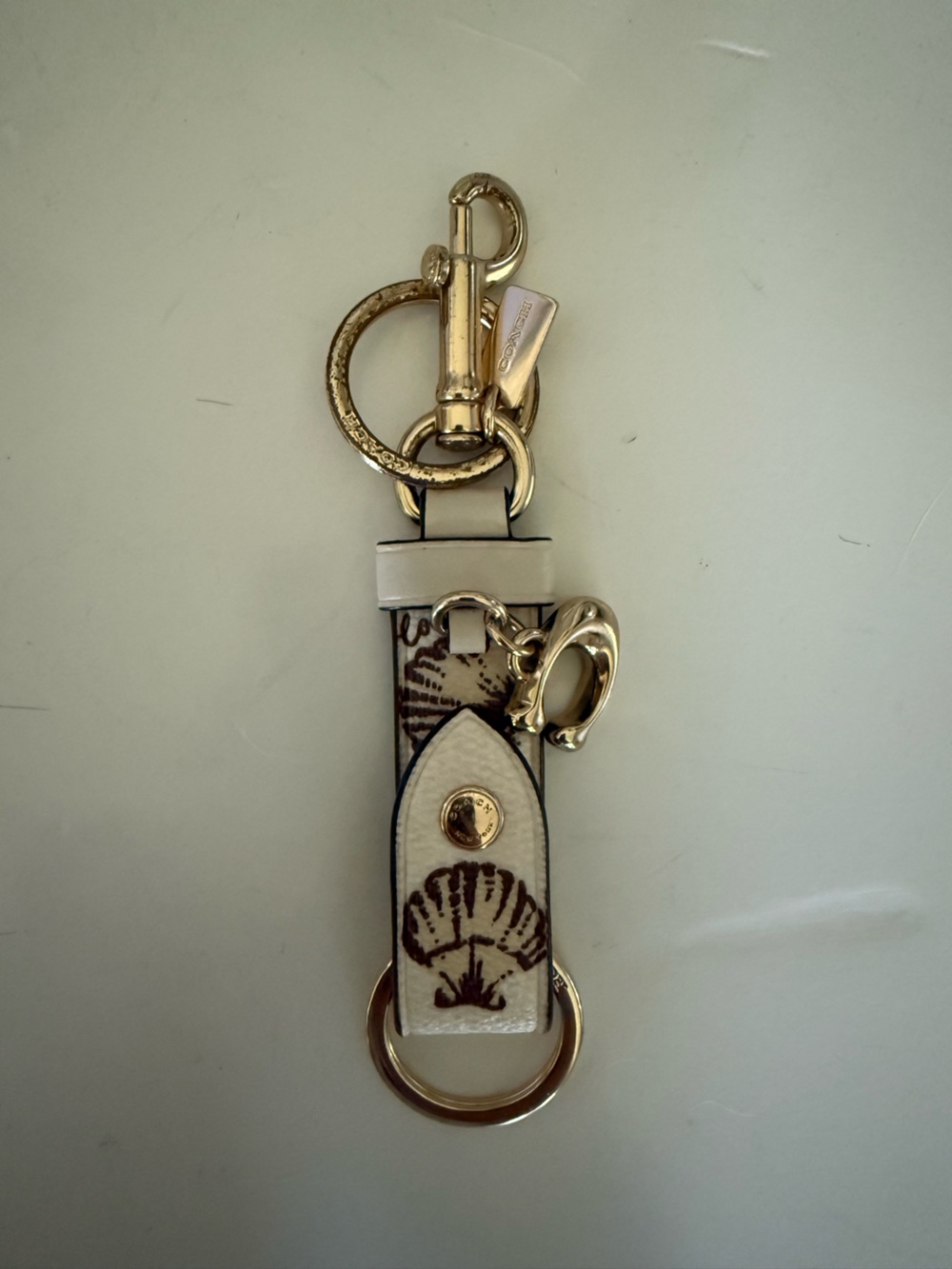 Coach White Seashell Keychain Gold Hardware